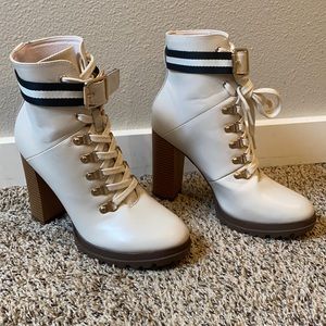 Size 9 cream tie up boots with gold details.